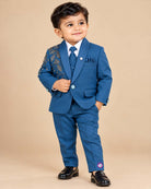 Boys embellished tuxedo suit set with botanical lapel embroidery, matching tie, and pant.