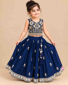 Girls sleeveless embroidered choli lehenga set with beaded fringe hem, tassel drawstring, and pleated flared skirt.