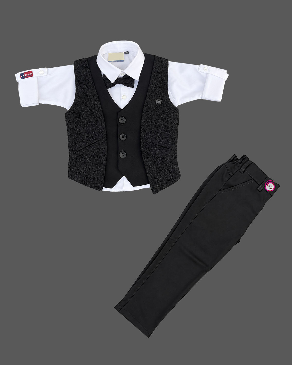 Boys textured layered waistcoat suit set with shirt, bow tie, sleeve roll-up tabs, and pant.