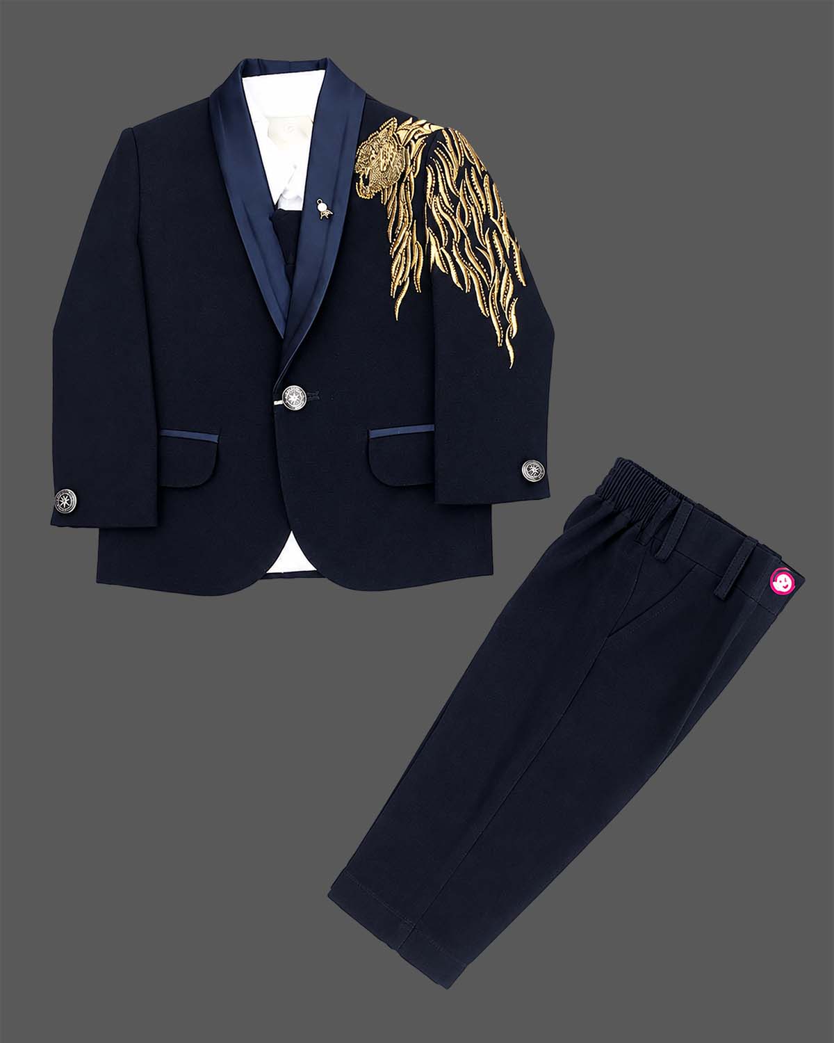 Boys blue designer tuxedo suit set featuring a shawl collar blazer with intricate gold shoulder embroidery, shirt, waistcoat, bow, and matching blue formal pant
