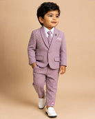 Boys dusty mauve formal suit blazer with shoulder sequin embellishments and tassel fringe, tie, pocket square, paired with elastic waist formal pant
