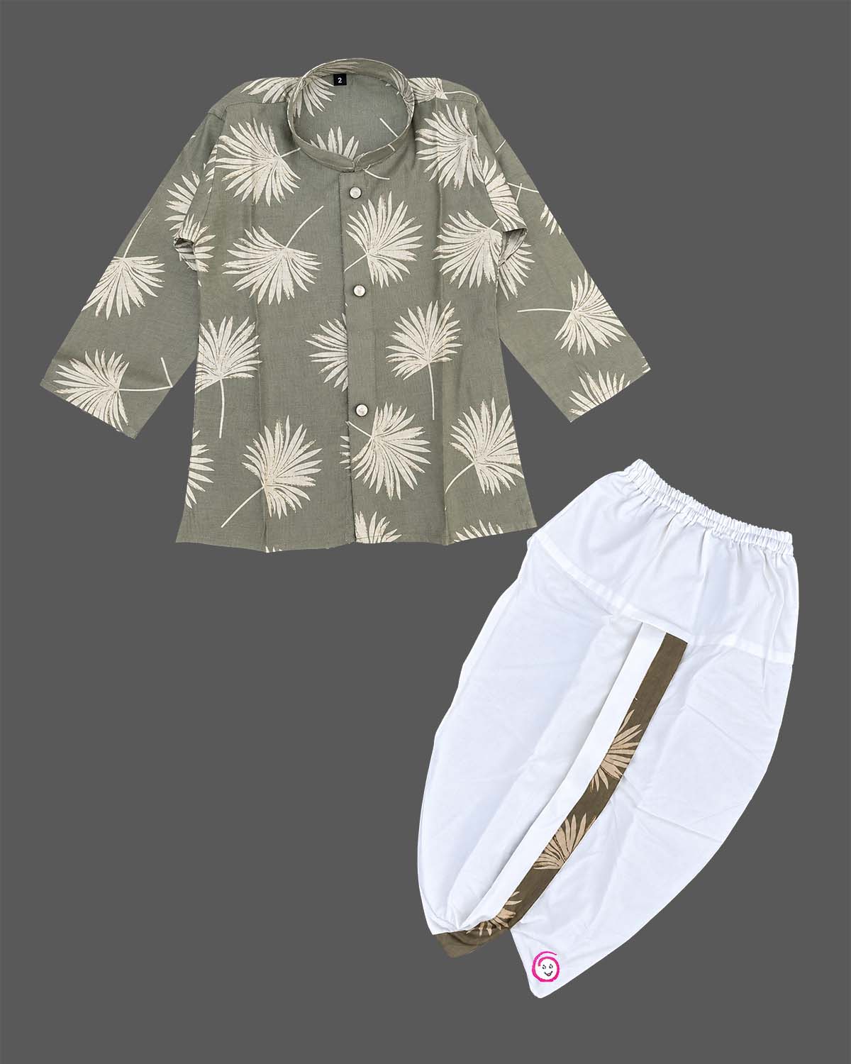 Baby boy ethnic kurta pant set featuring botanical leaf prints, mandarin collar, and roll-up sleeves.