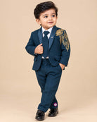 Boys embroidered tuxedo suit set featuring metallic shoulder embroidery, satin shawl lapel blazer, tie, and pant.