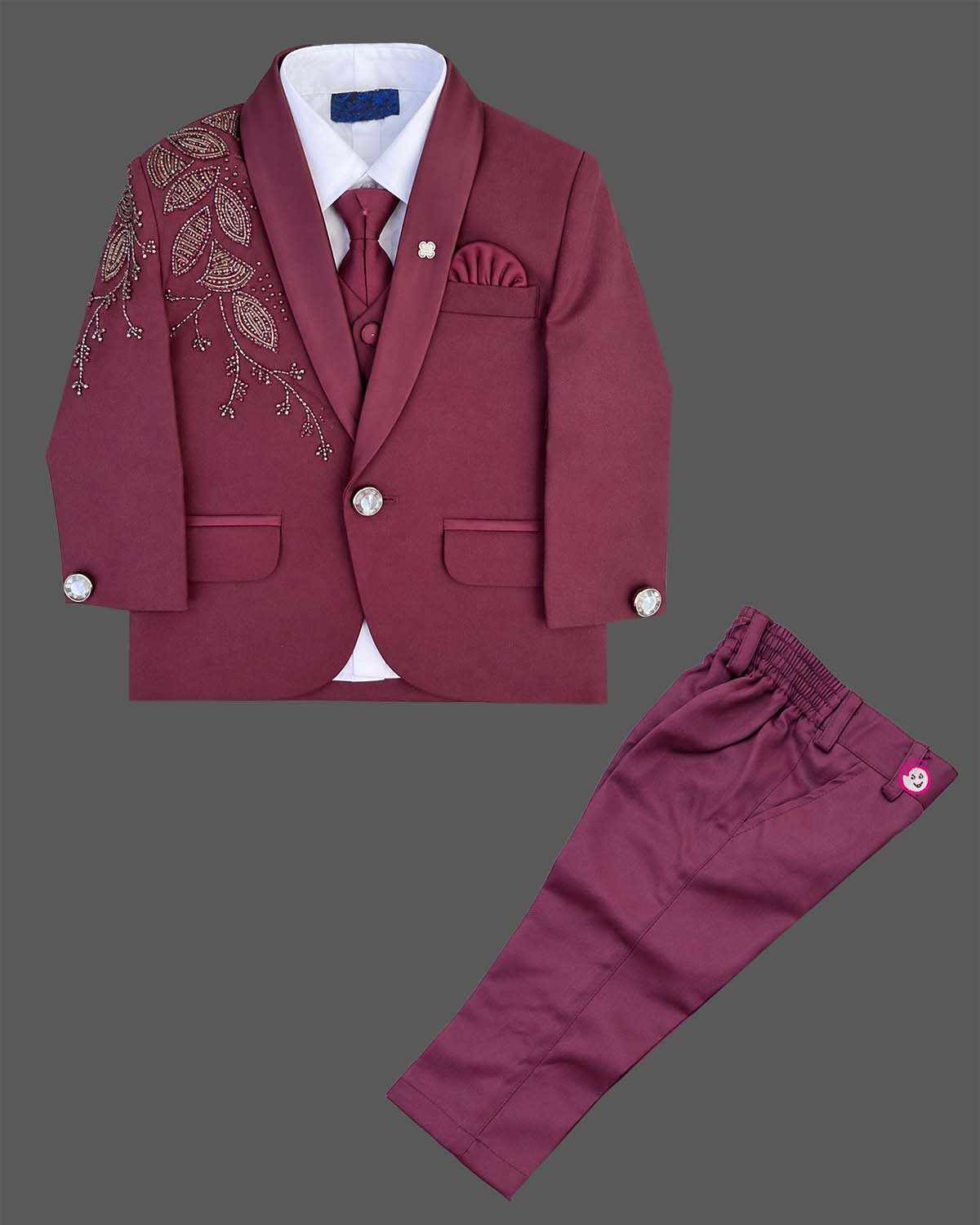 Boys tailored three-piece suit set featuring structured blazer, button-down shirt, and dress pant for events.
