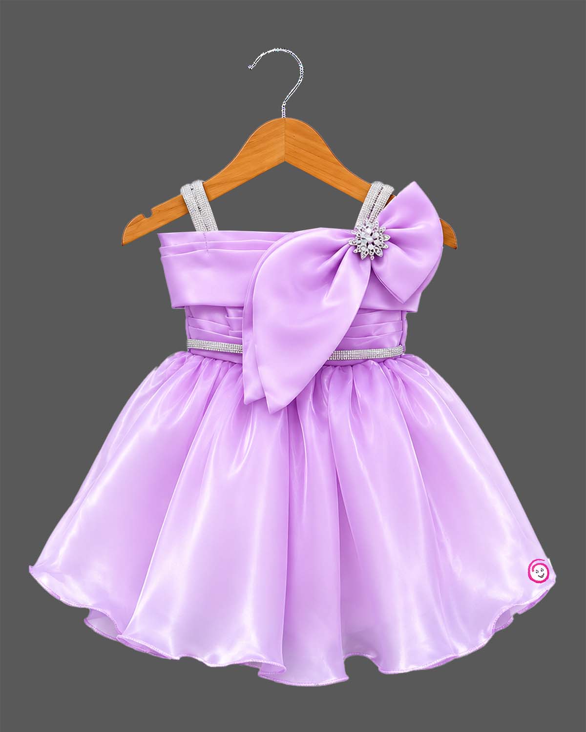 Lavender satin and organza party frock for baby girl featuring oversized side bow, rhinestone shoulder straps, and crystal brooch for birthday and wedding celebrations