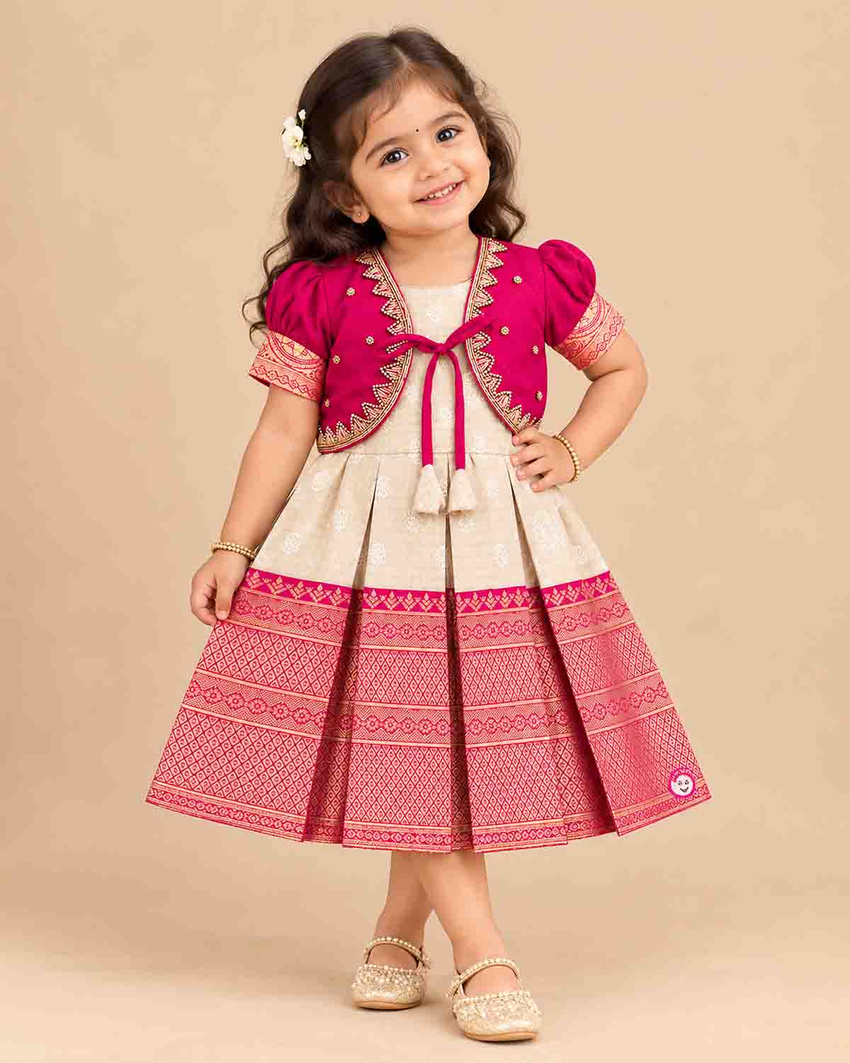 Pattu frock with beaded jacket, puff sleeves, front tassel tie and box-pleated zari border skirt for girls