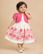 Little girl off-white and pink floral embroidered cotton dress paired with a cropped pink short sleeve jacket