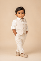 Boys textured linen waistcoat set featuring a collared shirt, matching bowtie, and tailored trousers.