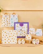 Printed newborn baby essential hamper featuring jhablas, nappies, bonnet, blanket, mittens, and booties perfect gifting combo