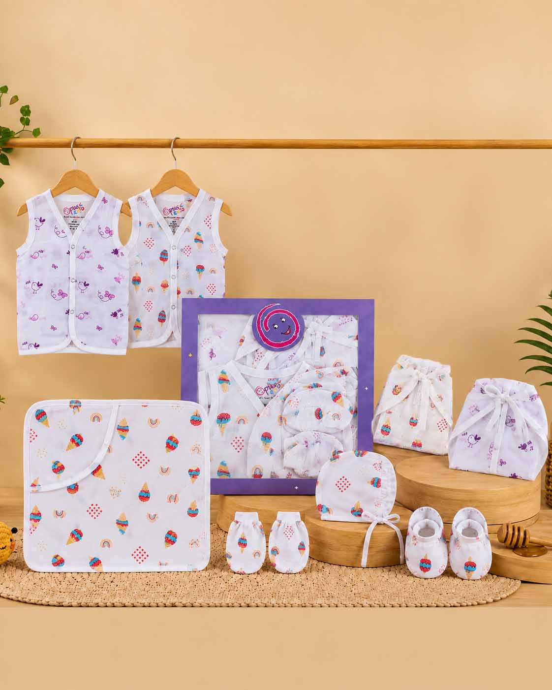 Newborn infant essential cloth gift combo featuring sleeveless vests tie nappies hooded wrapping towel bonnet mittens and booties