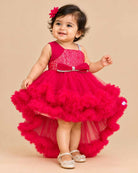 Sequined high-low baby party wear dress with layered tulle ruffle skirt and embellished strap.