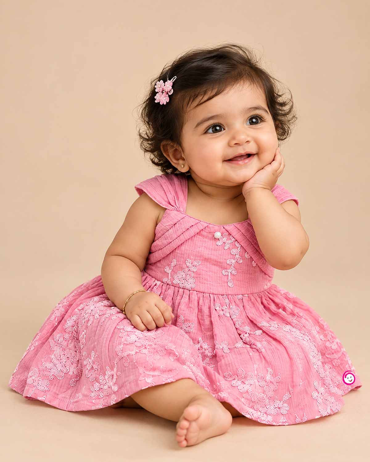 Toddler floral embroidered muslin frock with pleated cap shoulder straps and gathered A-line flared skirt.