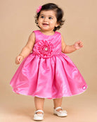 Silk frocks for baby girl featuring rosette bodice and pleated fit-and-flare satin skirt