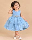 Powder blue satin frock for girls featuring floral beaded waist embellishments and pearl trim hem
