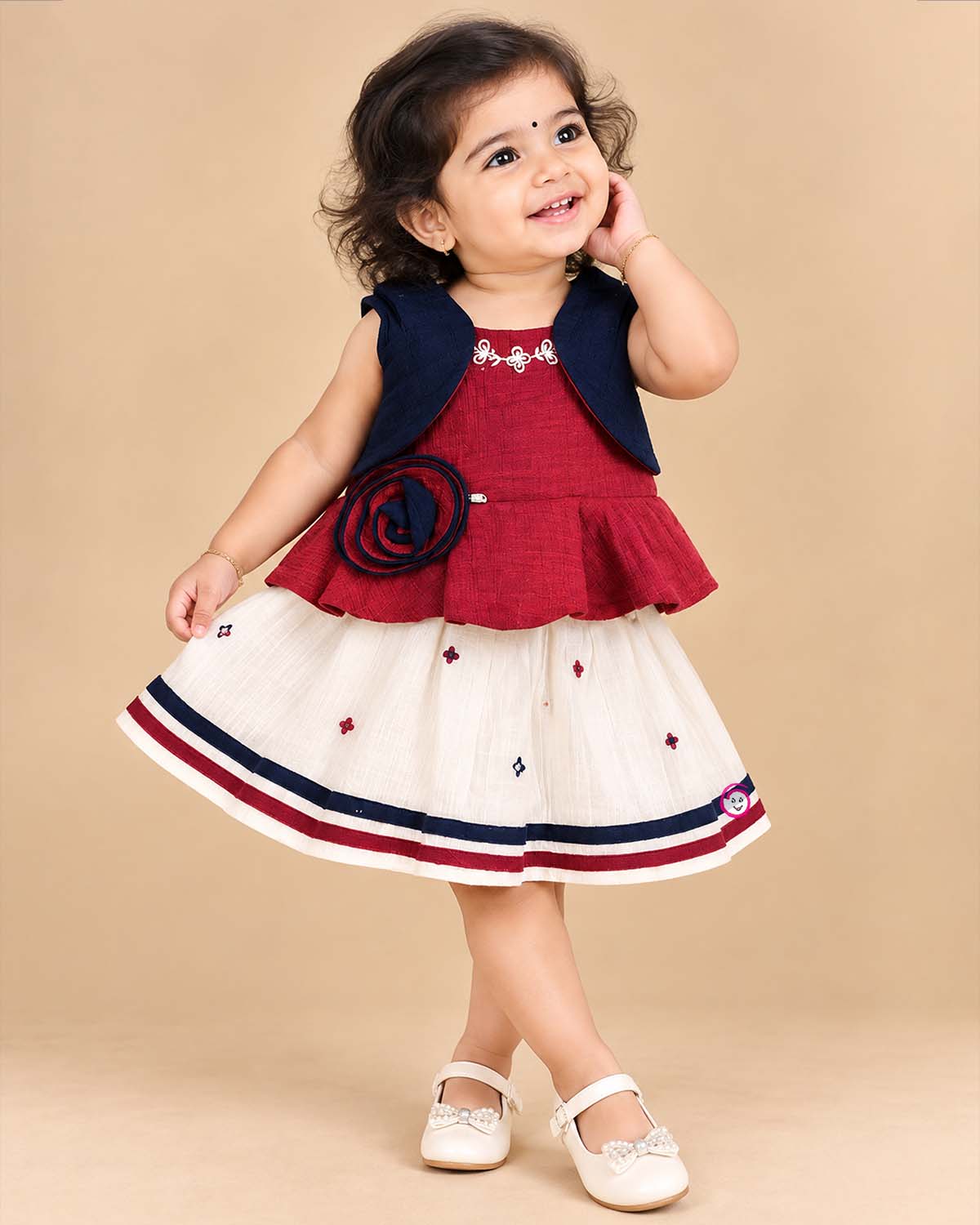 Toddler top and skirt set featuring jacket layer and embroidered details