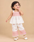 Baby girl embroidered cotton top and pant set featuring shoulder straps and matching wide leg pants for festive occasions