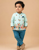 Boys light blue ethnic silk sherwani with vibrant elephant and deer motifs, mandarin collar, pocket square, paired with blue elastic waist pant