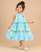 Girls sleeveless tiered chiffon midi party dress with sequin embellished scoop neckline and ruffled layers.