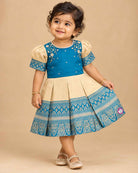 Kids silk ethnic frock featuring floral hand embroidery and woven zari border for traditional parties