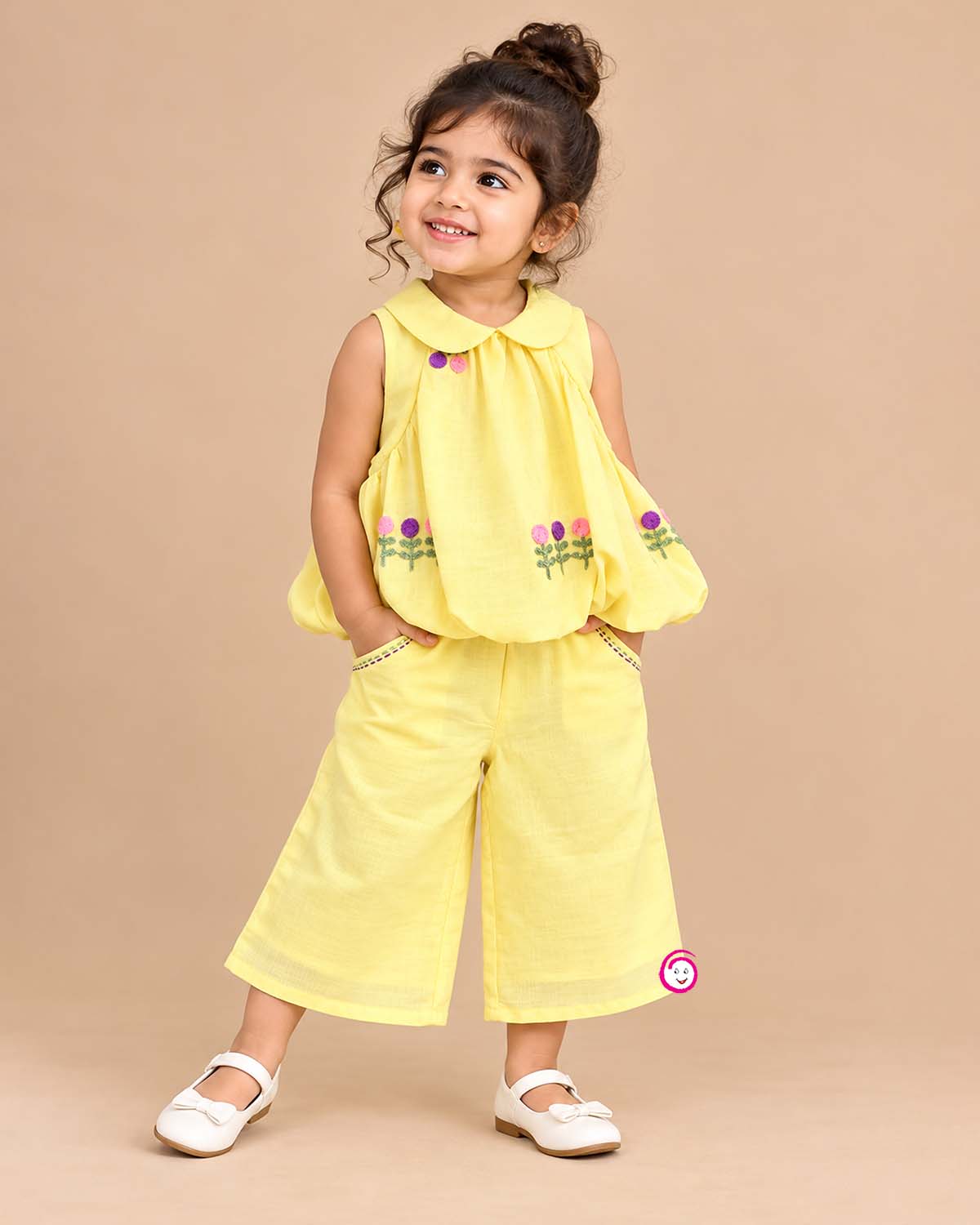 Sleeveless peter pan collar bubble top with floral embroidery paired with matching straight pant
