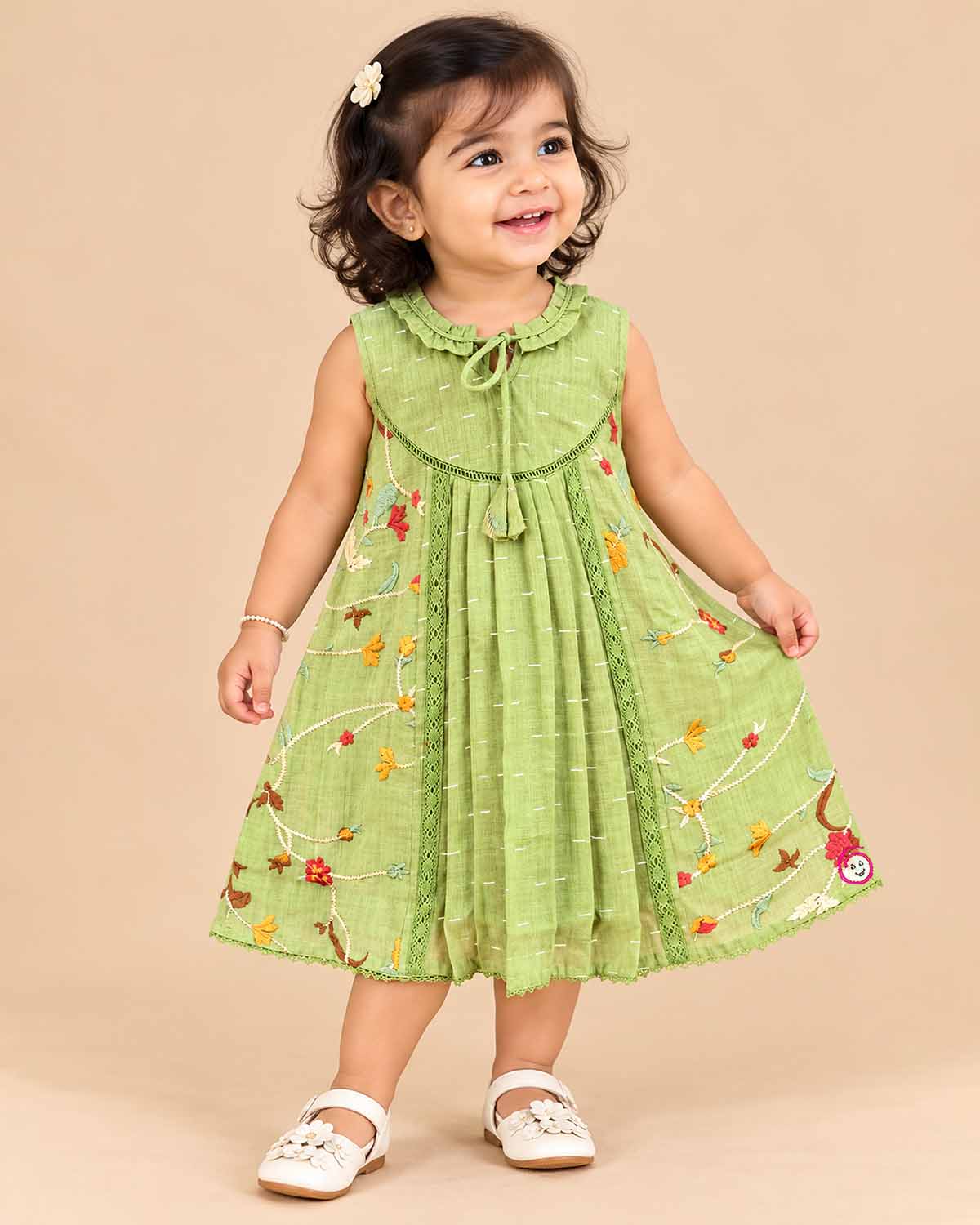 Baby girl floral embroidered frock with round neck and tassel tie for family function and birthday party