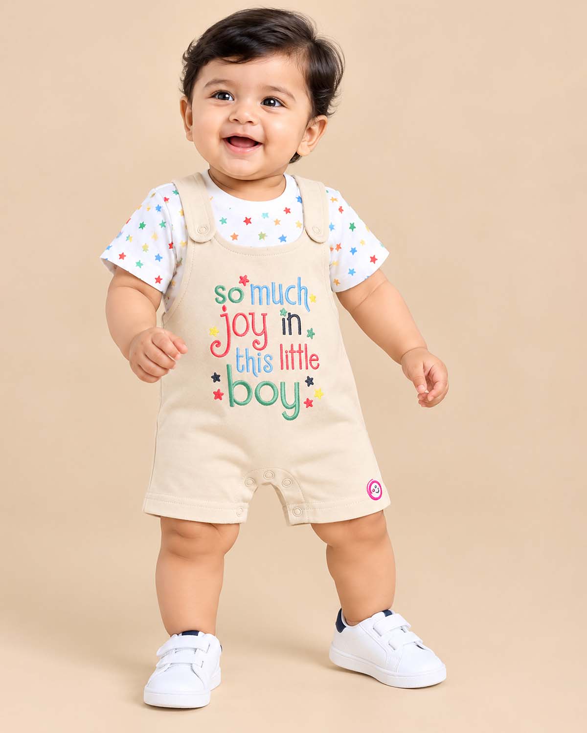Baby clothes set featuring a white star print t-shirt and beige printed romper