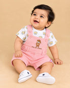 Baby clothes set featuring printed t-shirt and dungaree shorts with bear patch for toddler boys