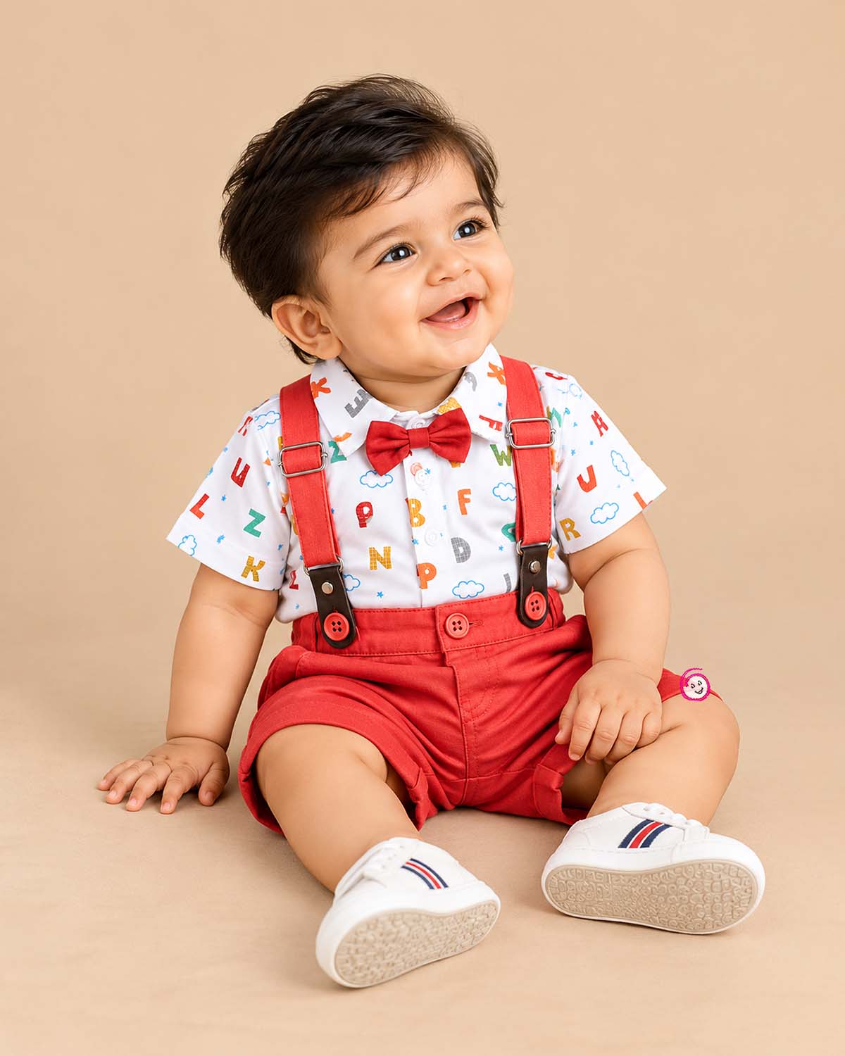 Charming infant suspender set with printed shirt and bow for party wear