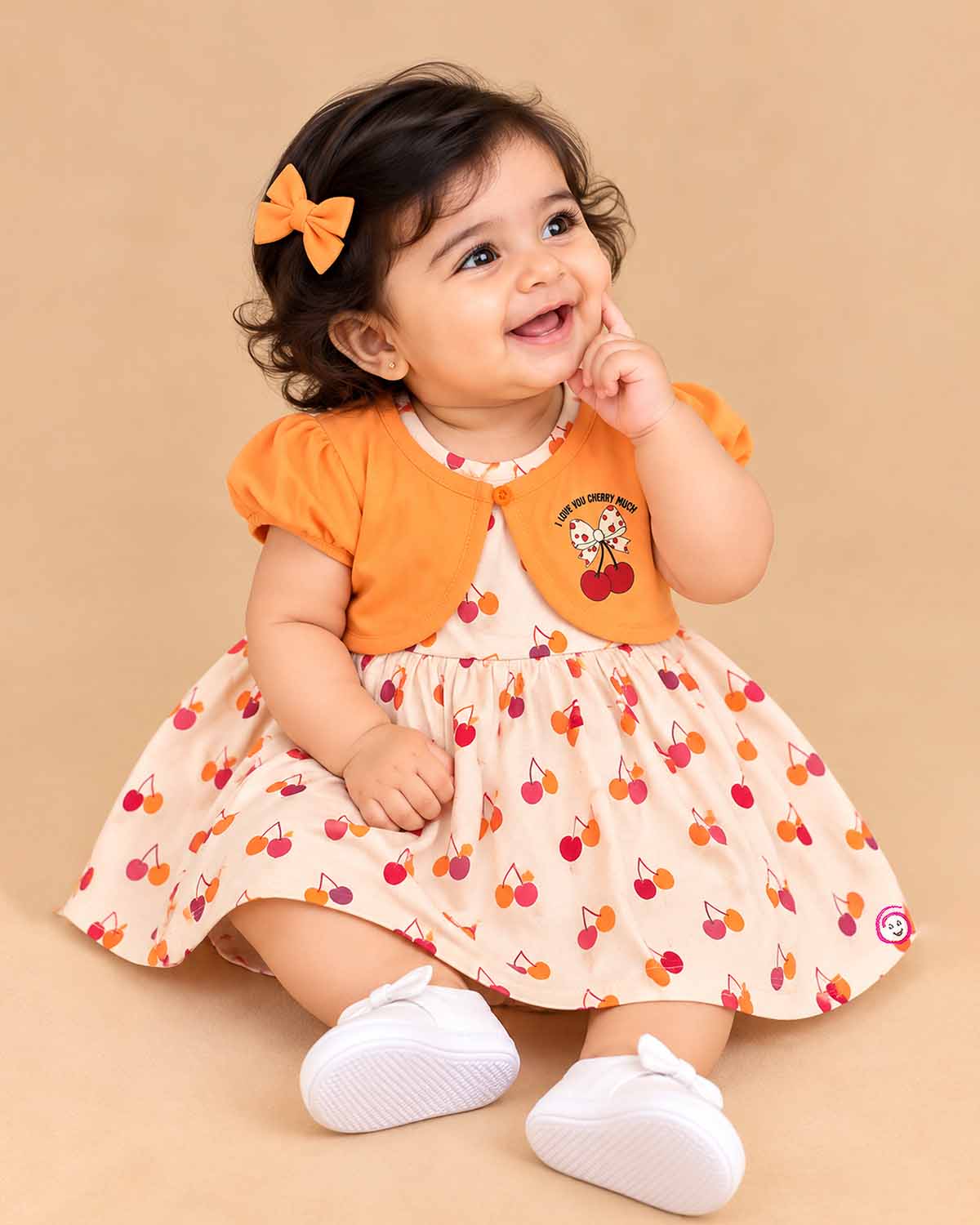 Infant cotton frock with short puff sleeves and printed pattern for casual outing