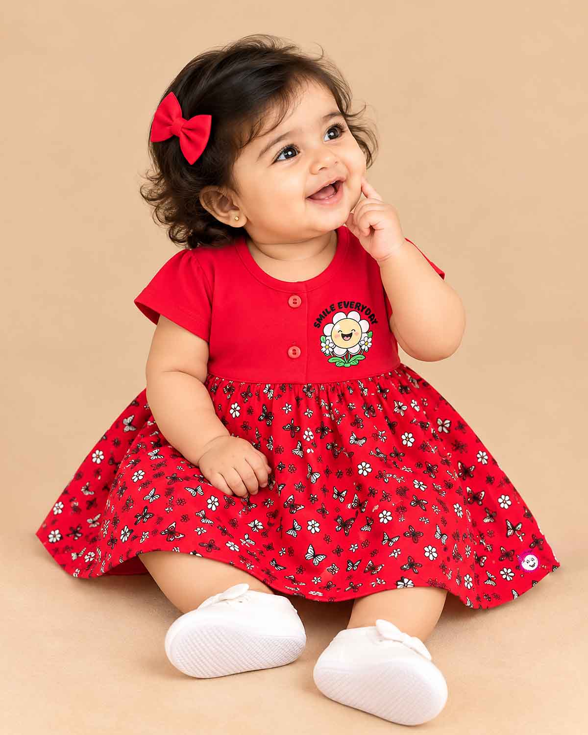 Infants frock with printed flared skirt and button detailing on top for daily casual wear