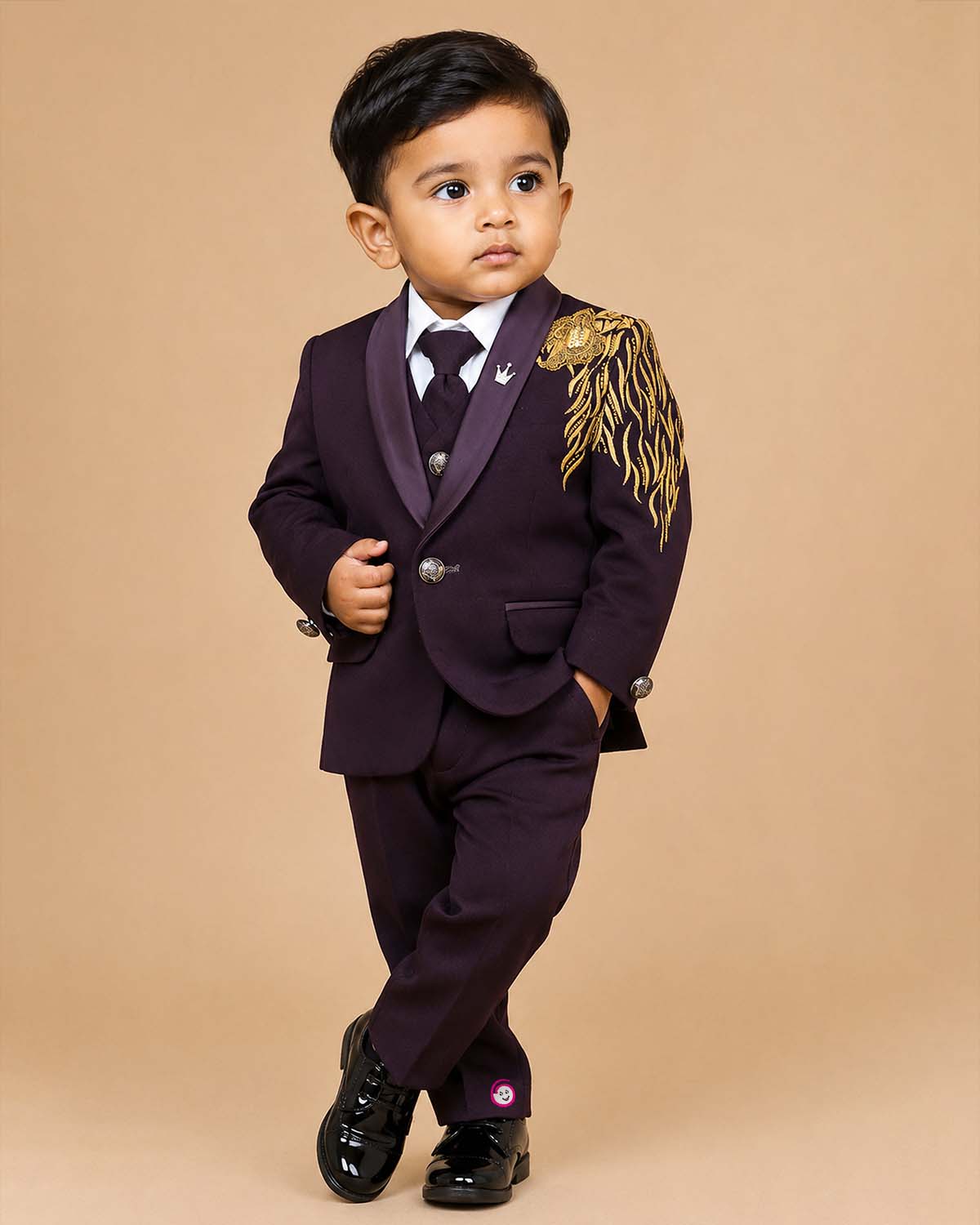 Boys wine designer tuxedo suit set featuring a shawl collar blazer with intricate gold shoulder embroidery, shirt, waistcoat, tie, and matching formal pant