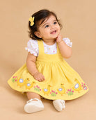 Infants frock set featuring a puff sleeve t-shirt and embroidered pinafore dress for girls.