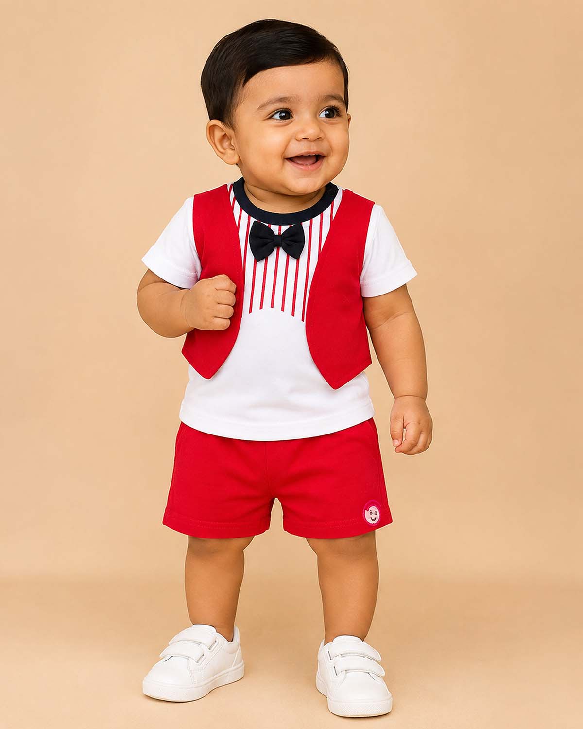 Toddler boys casual two-piece outfit featuring a short-sleeve top with a striped print and bow tie design, paired with matching elastic-waist shorts.