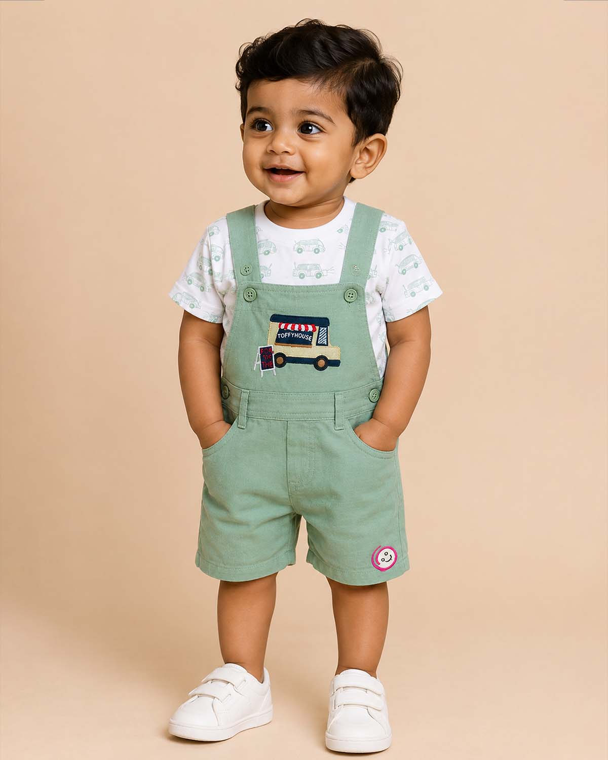 Playful young prince short sleeve vehicle pattern tee and bib shorts set for active kids