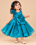 Teal blue satin party frock for toddler girls with large floral accents on shoulder and waist