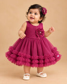 Toddler party frock with pleated diagonal bodice floral applique waist and tiered ruffle net flared skirt