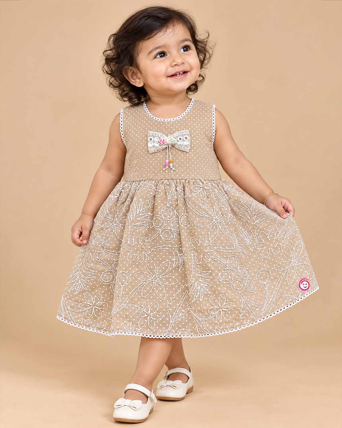 Toddler girl sleeveless embroidered cotton frock with bow detail for casual playdates