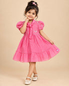 Pink georgette frock with white embroidery and puff sleeves for baby girls