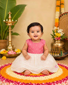 Traditional sleeveless festive attire for a little princess featuring subtle metallic buttis and a gathered flared skirt.