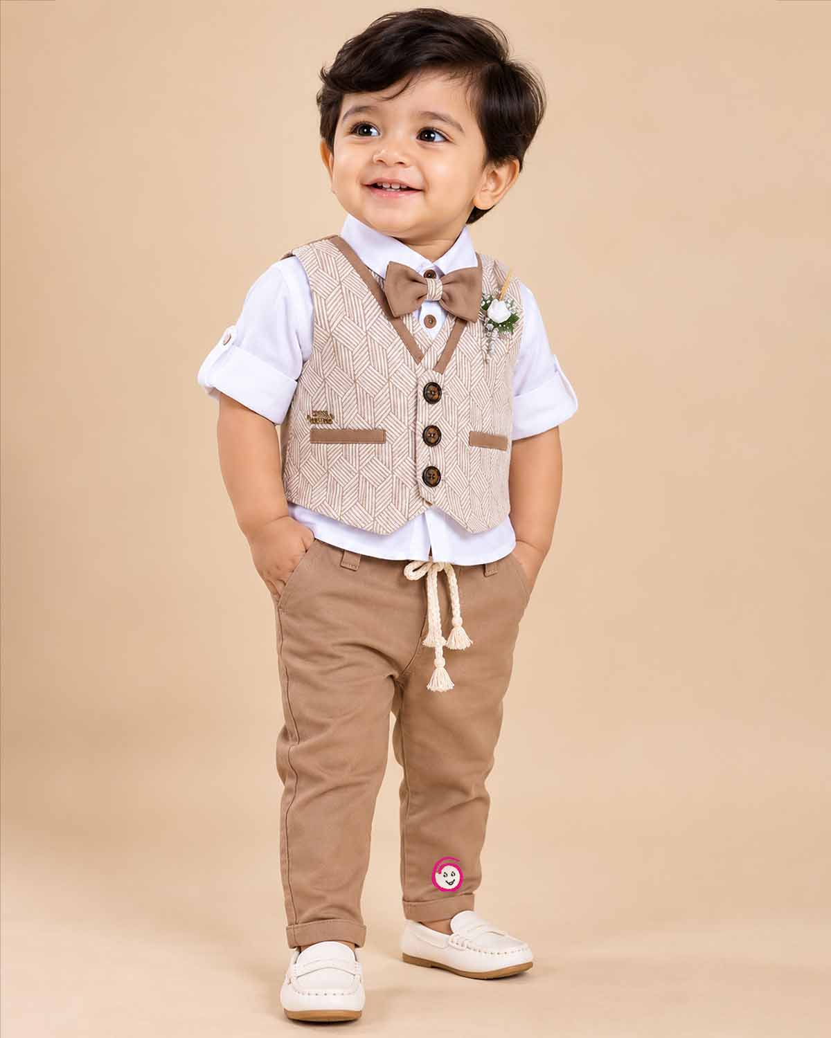 Toddler boy wearing a sharp waistcoat suit set with bowtie and shirt for special events.